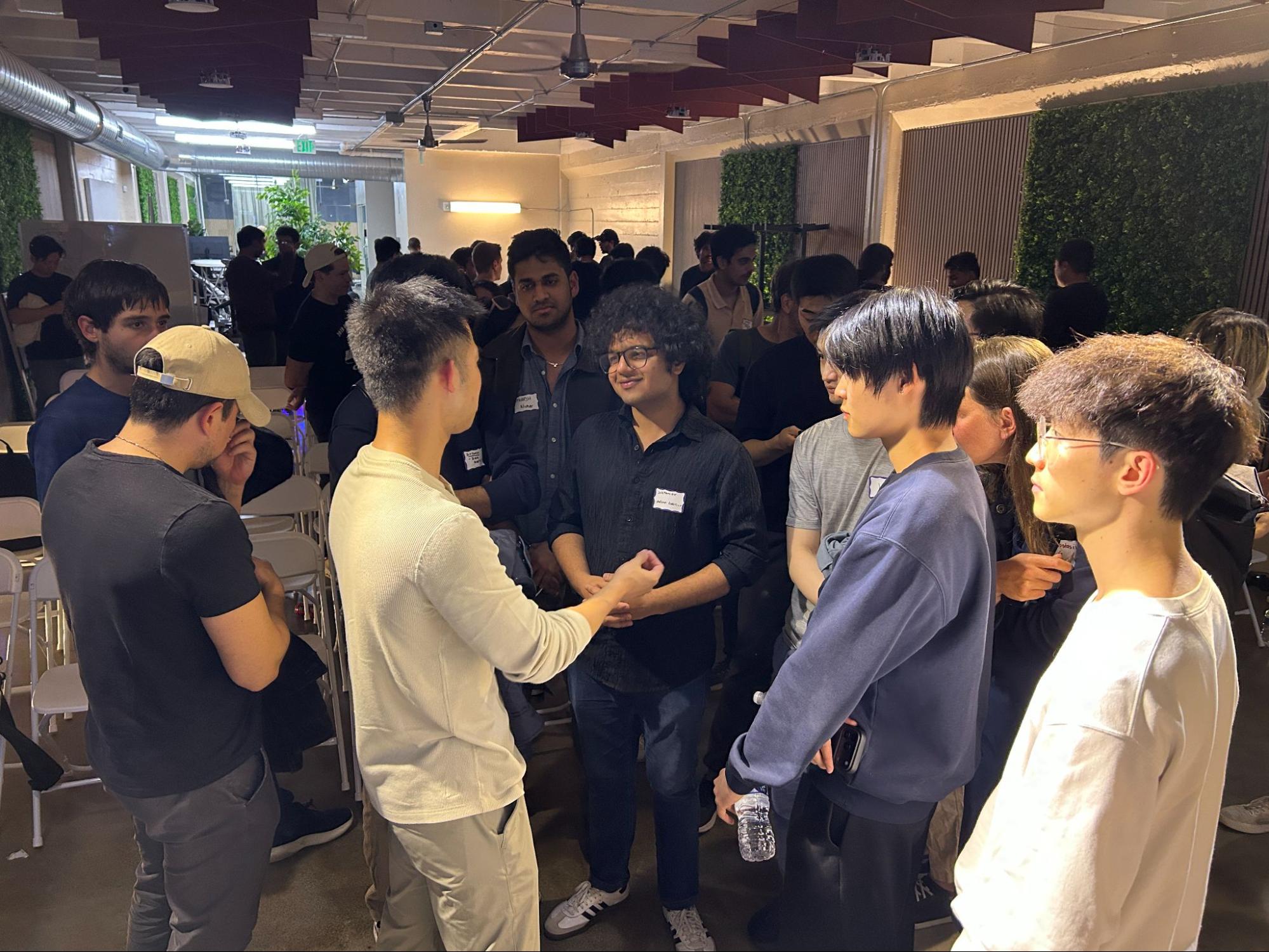 Attendees in conversation after the session