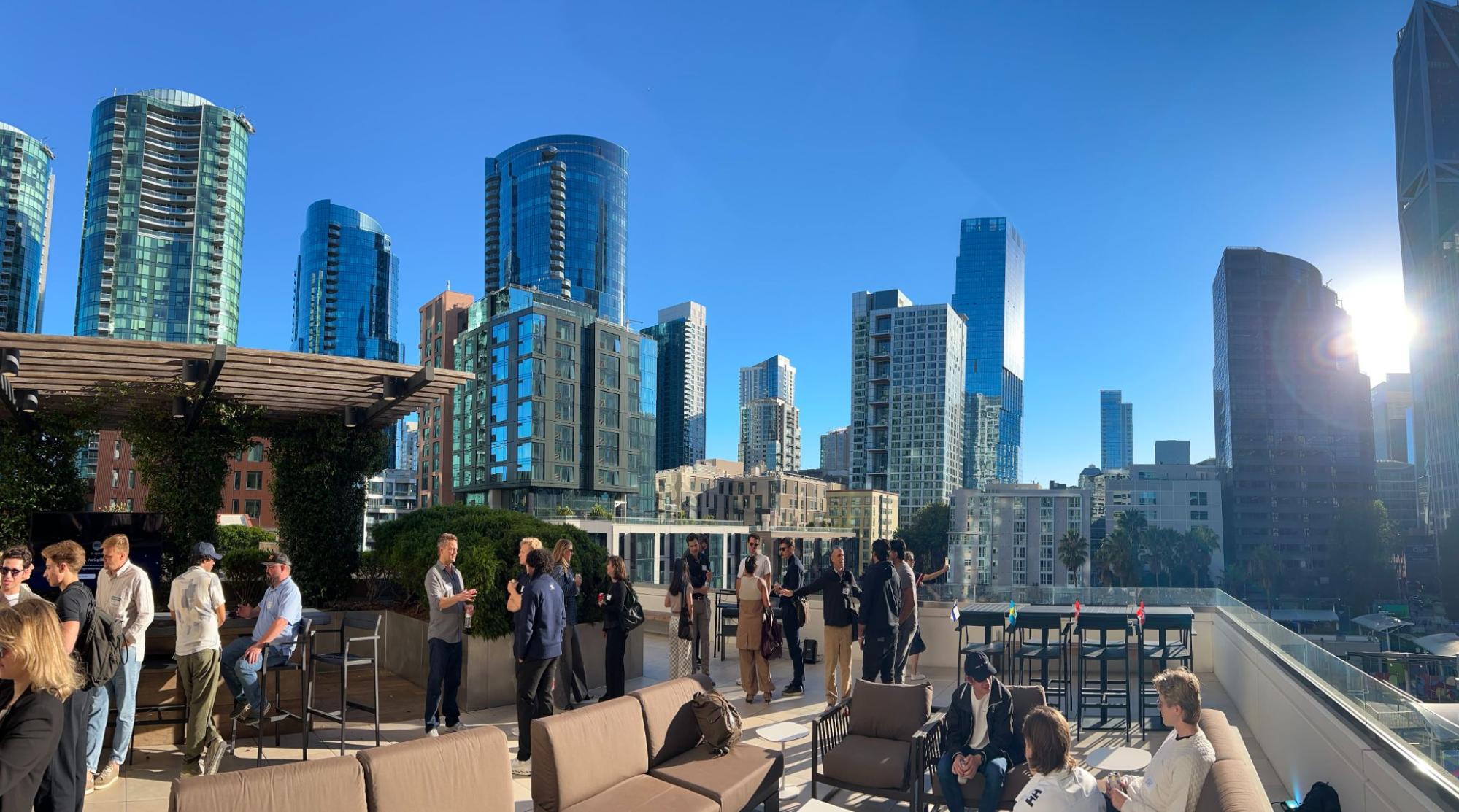 Guests at the Nordic Rooftop Happy Hour in San Francisco, 7 October, with the flags of the Nordic countries on the tables.